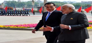 Prime Minister Narendra Modi with Chinese Premier Li Keqiang at the official welcome ceremony at Great Hall of People in Beijing on Friday. (UNI)