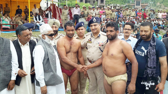 Wrestlers being felicitated during Indian Style Wrestling competition organized by Rajouri Police on Sunday.