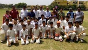 Young Cricketers posing for a group photograph alongwith DYSSO Jammu Sukhdev Raj Sharma during Inter-Zonal U-14 cricket tournament in Jammu on Wednesday.