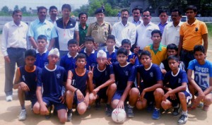 Winners of Volleyball competition posing along with dignitaries in Samba.  