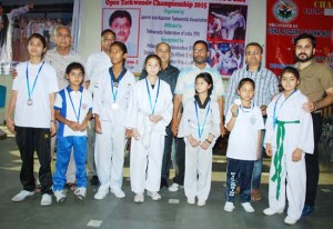 Players and dignitaries during inaugural ceremony of 2nd Vishal Memorial Open Taekwondo Championship in Jammu on Saturday.