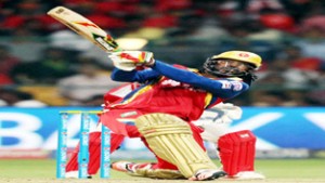 RCB’s Chris Gayle executing a slog sweep during his knock of 117 runs against Kings XI Punjab on Wednesday.