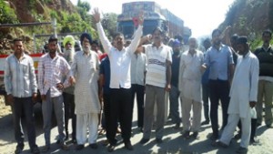Locals protesting against bad condition of National Highway at Udhampur on Friday. 