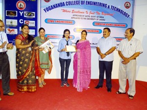 Winner of T-Shirt Designing Competition posing for a group photograph along with dignitaries at YCET in Jammu.