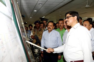 Union Minister Dr Jitendra Singh being briefed by Executive Engineer Central University Jammu about developmental works on Sunday.      -Excelsior/ Gautam