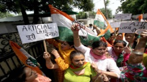 Mahila Cong activists staging protest outside DyCM’s residence in Jammu on Monday. —Excelsior/ Rakesh
