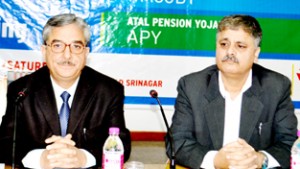 Commissioner, Commercial Taxes Department, Zaffar Ahmad and president, J&K Bank, SK Bhat, during a meeting of SLBC at Srinagar.