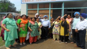 FMPHWs and others during a protest in front of CMO office, Poonch on Monday.