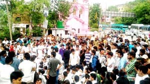 College students protesting at MH Chowk on Monday.