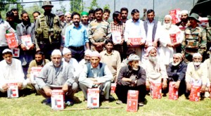 Beneficiaries posing for group photograph at Bandipora on Sunday.