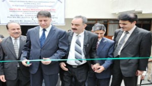 Justice Mohammad Yaqoob Mir, Executive Chairman J&K SLSA inaugurating Lok Adalat at High Court Srinagar wing. Also seen in the picture are Justice Hasnain Massodi, Justice Ali Mohammad Magrey and Justice Dhiraj Singh Thakur.