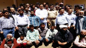 MLA Inderwal, GM Saroori interacting with people in Sarthal area on Sunday. 