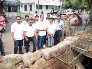 Speaker Legislative Assembly Kavinder Gupta inspecting a drainage work on Monday.