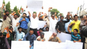 Protesters raising slogans in support of their demands on Sunday.