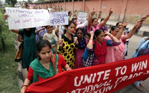 Anganwari workers and helpers taking out a protest rally in Jammu on Monday. -Excelsior/Rakesh