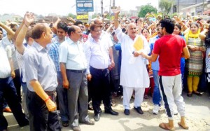 People of Channi Himmat Housing Colony during a protest demonstration on Thursday.