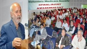 Minister for Education, Naeem Akhtar speaking at ‘Spinal Injury Awareness Day’ at Srinagar on Wednesday.