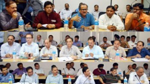 Deputy Chief Minister Dr Nirmal Singh chairing a meeting at Jammu on Saturday.