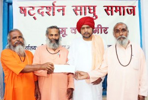 Sadhu samaj donating Rs one lakh for earth quake victims of Nepal at Jammu on Thursday.