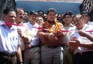MLA Jammu East, Rajesh Gupta throwing open gate of Raghunath Temple Jammu on Monday. -Excelsior/Rakesh