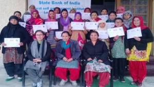 Participants of Dress designing course conducted by SBI-RSETI with their participation certificates on concluding day of the course at Leh. 