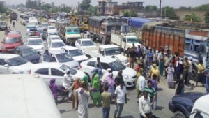 People protesting at Pali Morh on Friday. -Excelsior/Madan