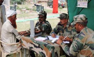 Army doctors examining a patient during a medical camp at Village Rakh Barotian in Samba district.