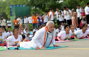 Prime Minister Narendra Modi performing  yoga with the participants on the occasion of the 1st International  Day of Yoga at Rajpath in New Delhi on Sunday. (UNI)