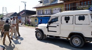 Security forces at the site of killing of a youth at Sopore on Sunday.— Excelsior/Aabid Nabi