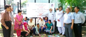 Women decorating `Raade' with dry colours during a function at Radio Kashmir Jammu on Monday. 