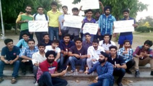 NSUI activists lighting candles before taking out peace march in Jammu on Monday.