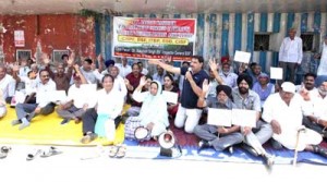 Members of Central Para Military Force Welfare Association sitting on protest dharna at Jammu on Thursday. -Excelsior/ Rakesh