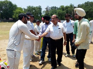 Ex-MLC Rattan Lal Gupta interacting with players at Satwari Cantt ground on Sunday.
