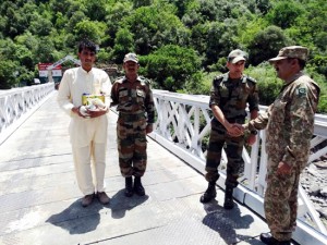 A PoK resident, Kashif Baig being handed over to his family members after a flag meeting at Uri crossing point located close to Kaman Aman Setu on Saturday. (UNI)