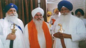 Mahant Manjit Singh (middle)  from Dera Nangali Sahib, Poonch, being honoured by presenting Siropa by Jathedars from Kesgarh Sahib and Patna Sahib during function at Sri Anandur Sahib in Punjab.