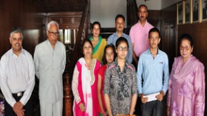 Governor and First Lady with meritorious students and their parents.