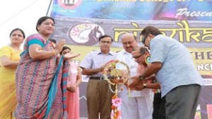 Dignitaries lighting lamp to declare tech fest at YCET open on Friday.