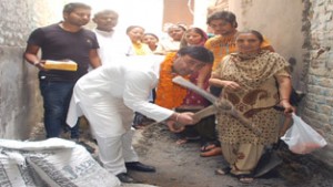 PCC general secretary Vikram Malhotra kick-starts work at Mohallah Paharian in Jammu East on Saturday. 