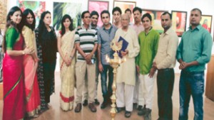 Participants of Art Exhibition posing with the chief guest during inaugural function at New Delhi.