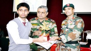 Army Officers presenting trophy & certificate to a winner of Inter School debate competition.  -Excelsior/Aabid Nabi