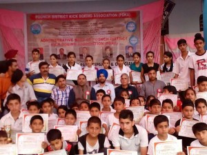 Participants of Kick Boxing Training Camp displaying certificates while posing foir a group photograph at Poonch.
