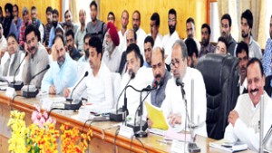 Member Parliament, Muzaffar Hussain Beigh chairing a meeting at Baramulla on Saturday.