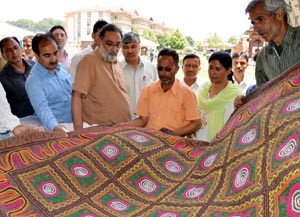 Minister for Finance, Dr Haseeb Drabu during his visit to Kashmir Haat at Srinagar on Sunday.