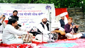 Artists performing during a folk music concert at Gandoh (Doda) on Monday.