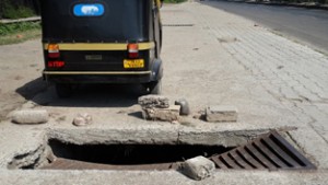 Damaged cover of a drain outside Jammu University posing risk to pedestrians. -Excelsior/Rakesh