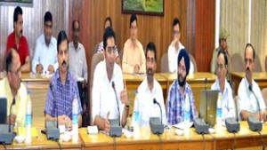 DDC Udhampur Dr Shahid Iqbal Choudhary presiding over a meeting of district officers and consultants of IT deptt on Tuesday. 
