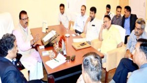 Minister for Industries, Chander Parkash Ganga chairing meeting at Srinagar on Wednesday.