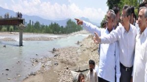 Minister for PHE, Sukhnandan Kumar Choudhary inspecting development work at Kulgam on Monday.