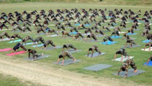 Jawans of Pattan Garrison under Chinar Corps attending yoga class on the occasion of World Yoga Day on Sunday. -Excelsior/Aabid Nabi