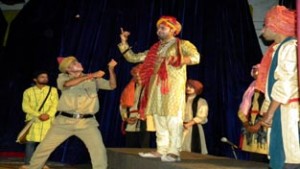 A scene from the play ‘Ek Tha Gadha Urf Aladad Khan’ staged in District Drama Festival, Reasi on Tuesday.